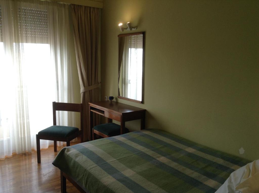 Postel nebo postele na pokoji v ubytování Hotel Alexandros