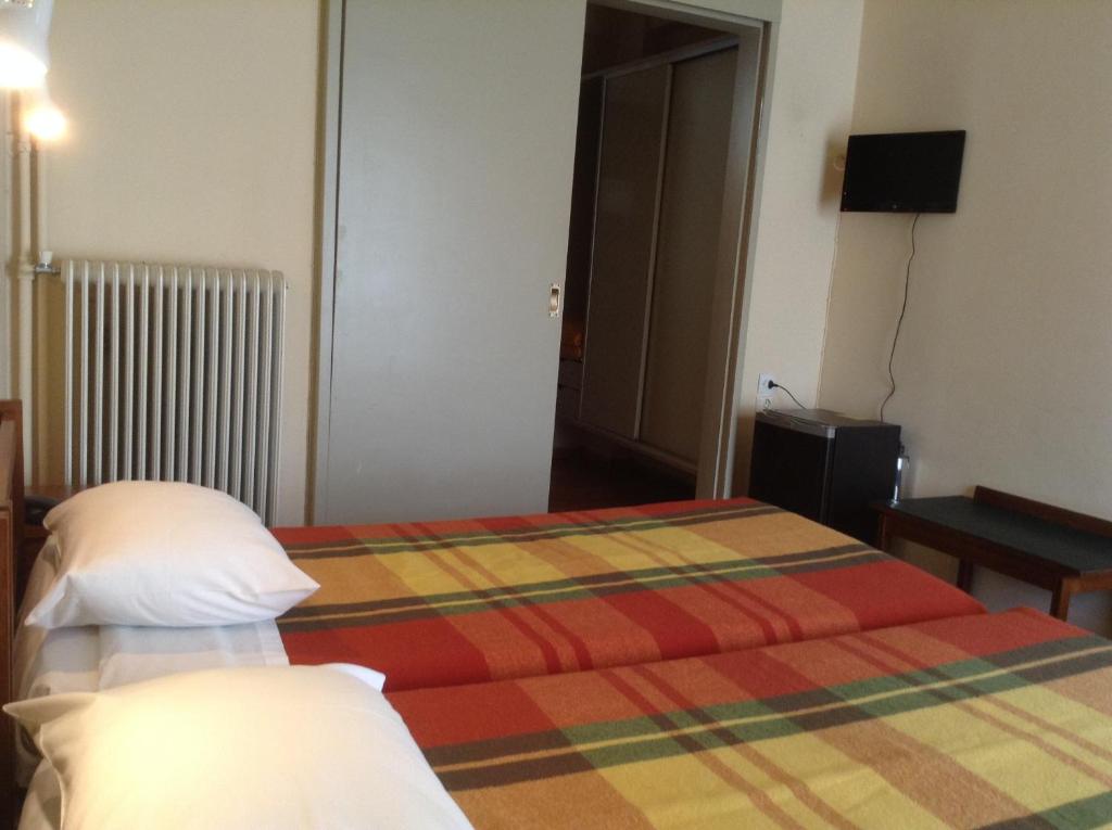 Postel nebo postele na pokoji v ubytování Hotel Alexandros