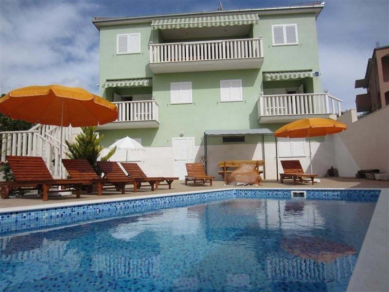 The swimming pool at or near Family friendly apartments with a swimming pool Okrug Gornji, Ciovo - 5218