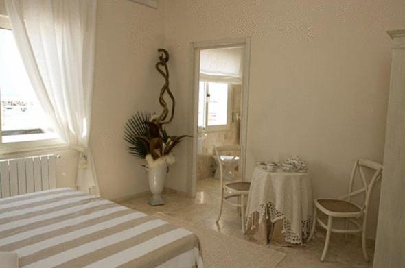Postel nebo postele na pokoji v ubytování Hotel Bagni Lido