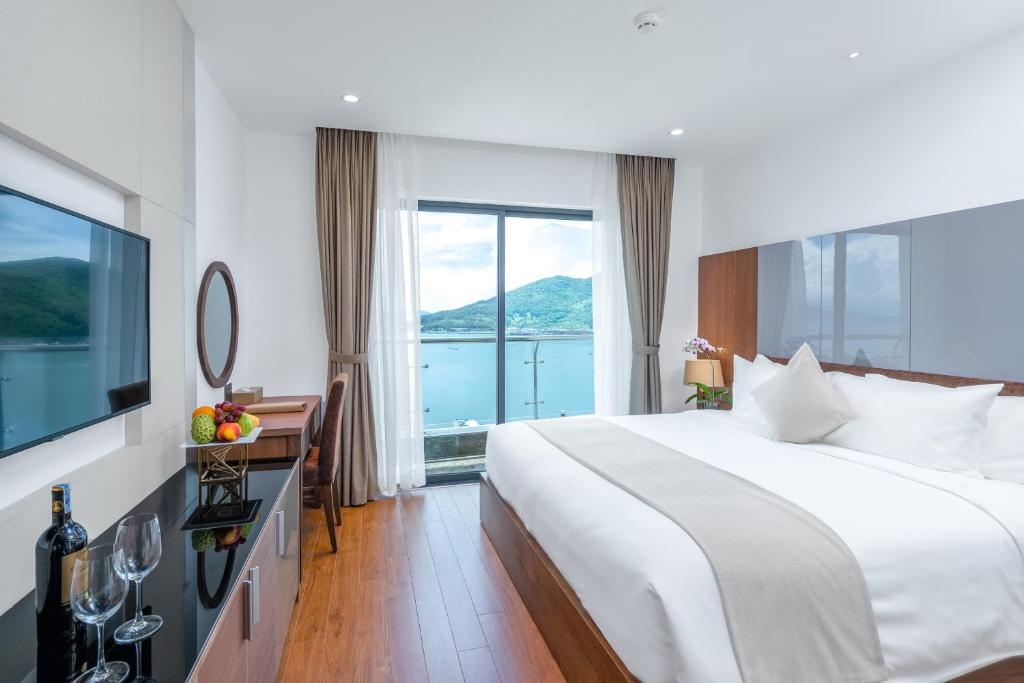 Postel nebo postele na pokoji v ubytování Alan Sea Hotel Danang