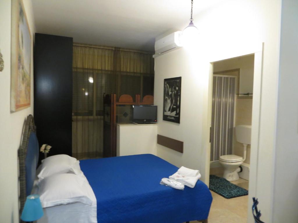 Łóżko lub łóżka w pokoju w obiekcie Aparthotel TURNONE