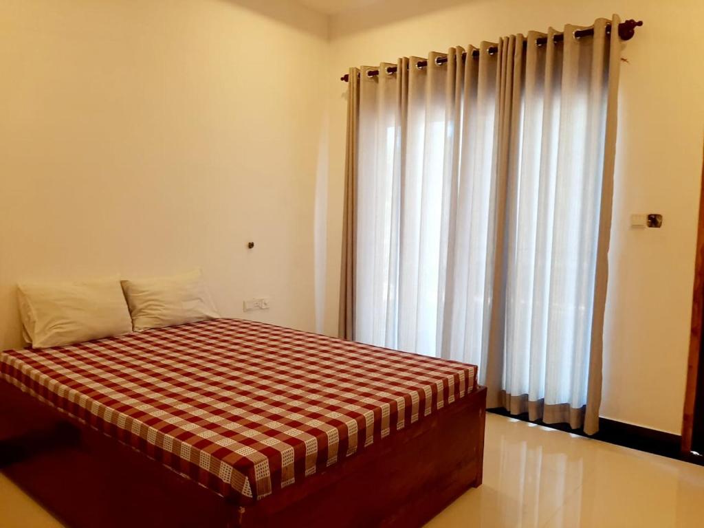 Postel nebo postele na pokoji v ubytování Hotel krish