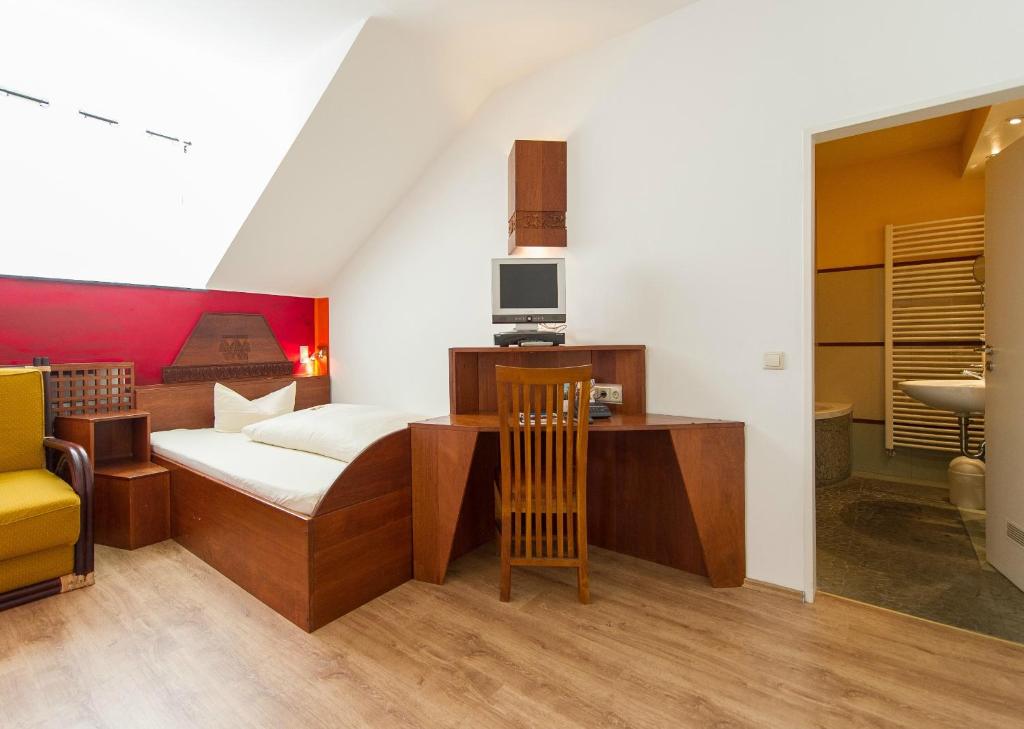 Postel nebo postele na pokoji v ubytování Hotel Monpti