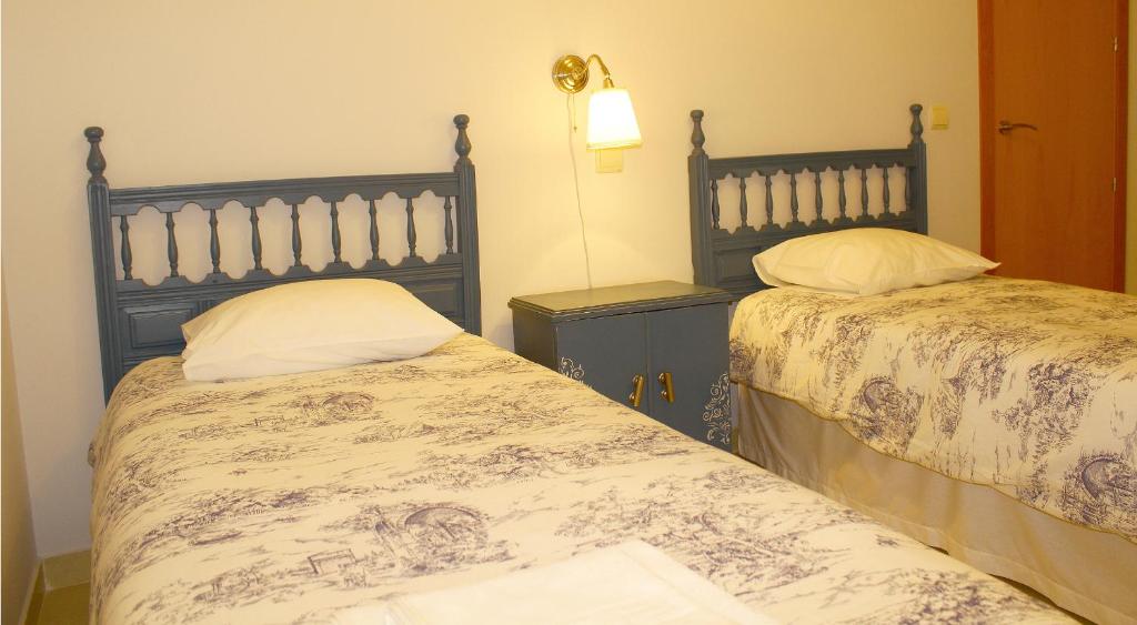 Postel nebo postele na pokoji v ubytování Apartamentos Puenteviejo