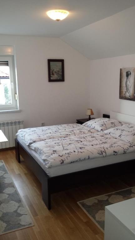 Postel nebo postele na pokoji v ubytování Rooms & Apartment Mira G.
