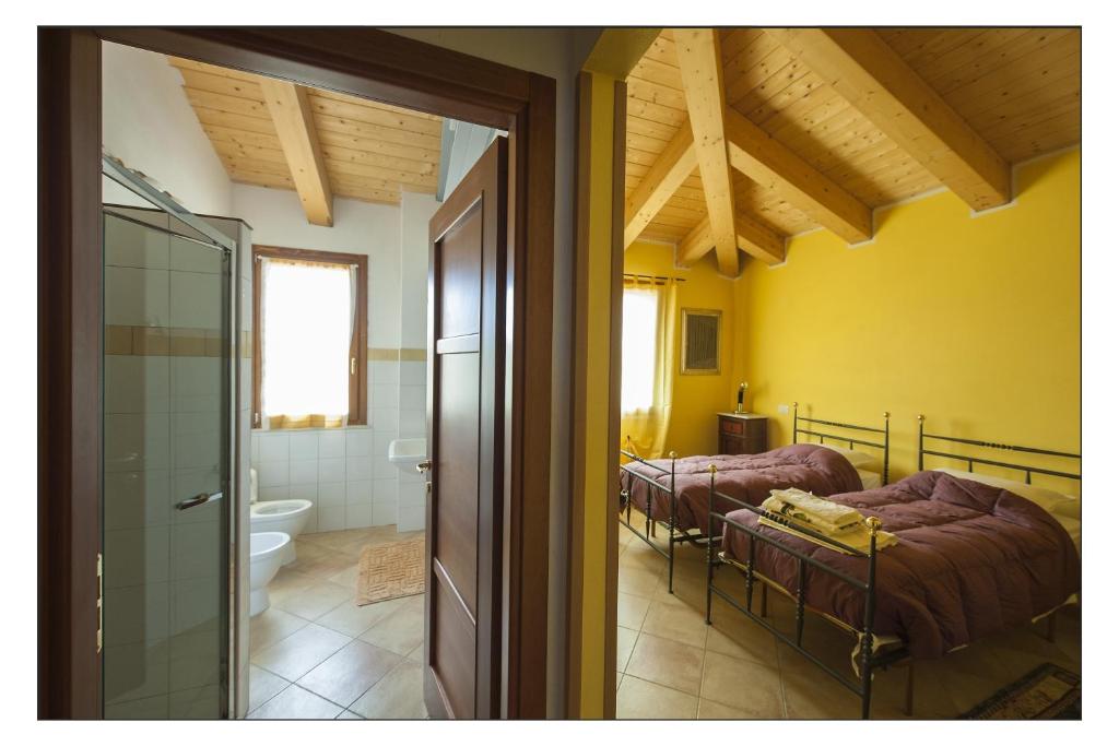 A bed or beds in a room at Bed & Breakfast Montesterlino