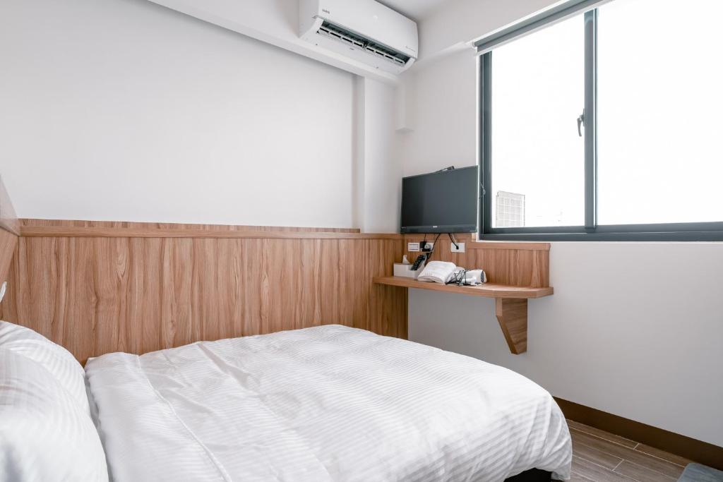 Postel nebo postele na pokoji v ubytování Sweet Summer Homestay