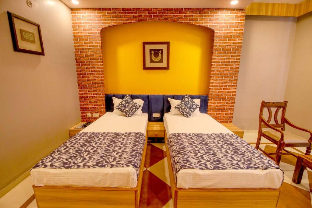 Llit o llits en una habitació de Gems Suites-A Boutique Stay