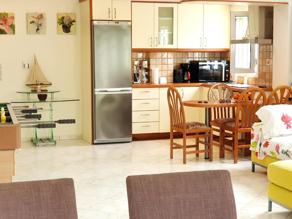 Kuchyň nebo kuchyňský kout v ubytování HOUSE SUITES DOMAINE