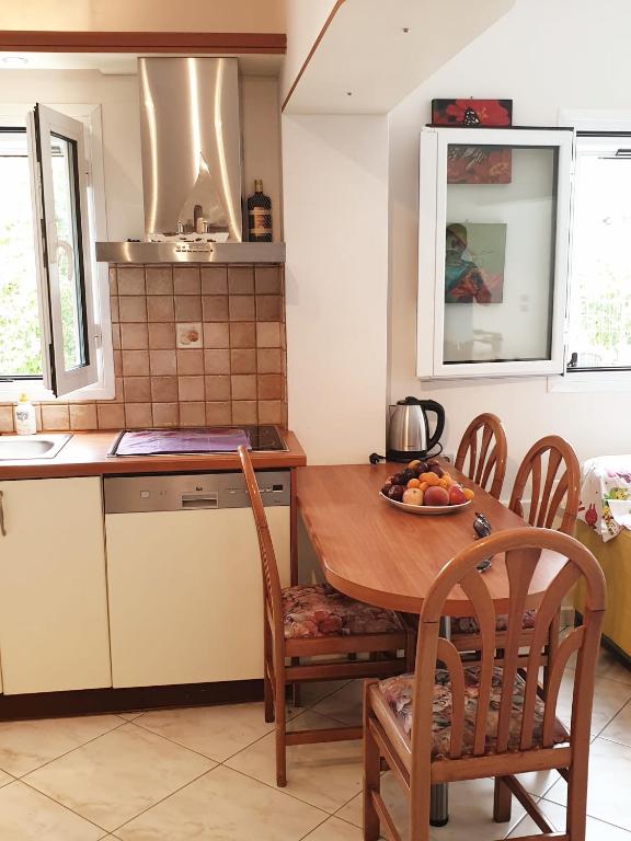 Kuchyň nebo kuchyňský kout v ubytování HOUSE SUITES DOMAINE