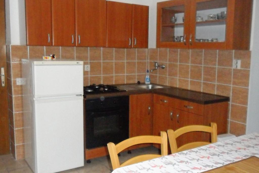 Kuchyň nebo kuchyňský kout v ubytování Apartment Suha Punta 5050a