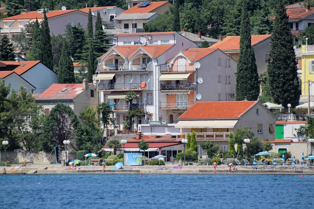 a town on the shore of a body of water at Apartment Selce 5206a in Selce