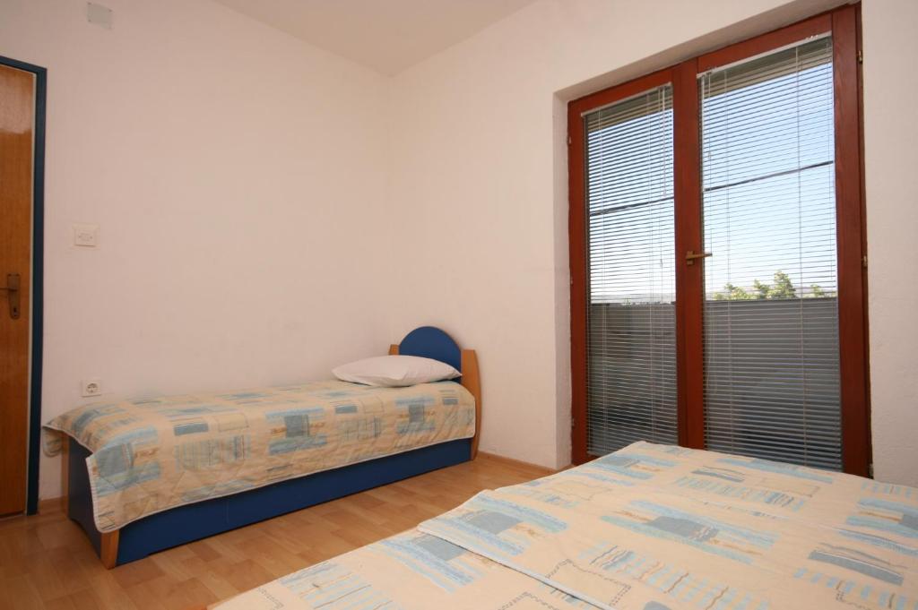 Posteľ alebo postele v izbe v ubytovaní Apartment Starigrad 6606b