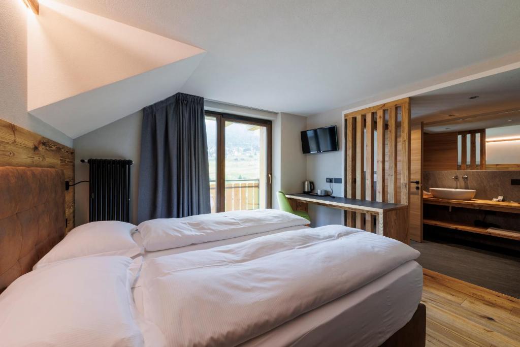 Postel nebo postele na pokoji v ubytování Steinbock B&B - Apartaments