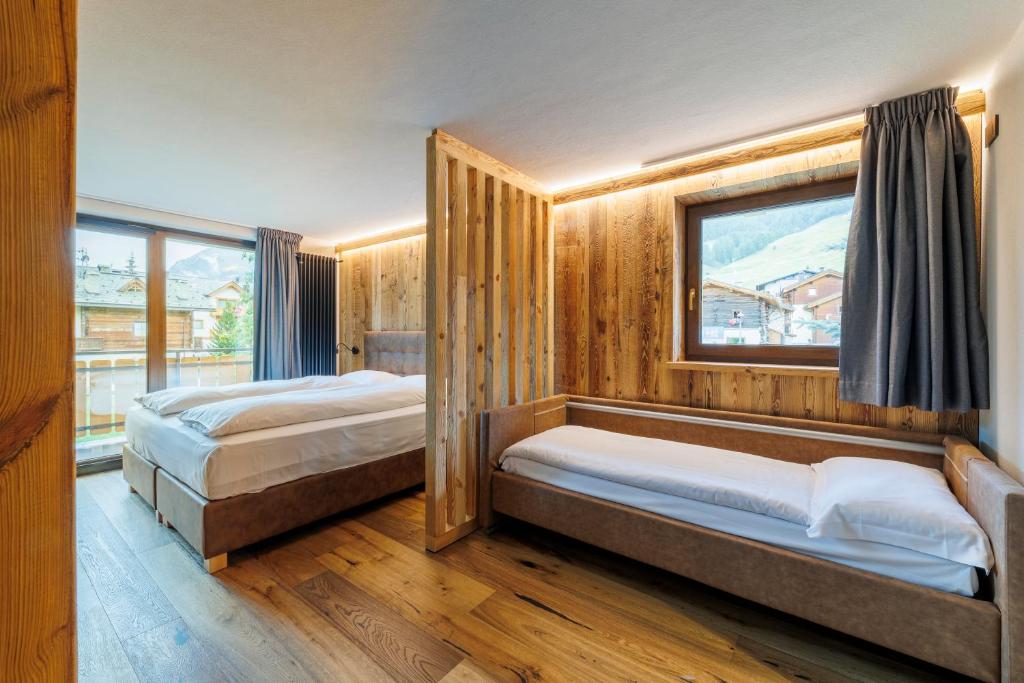 Postel nebo postele na pokoji v ubytování Steinbock B&B - Apartaments