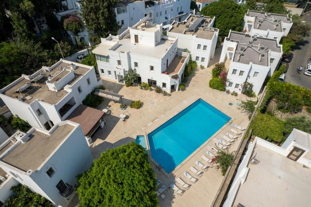 an aerial view of a house with a swimming pool at Seckin Konaklar in Bodrum City