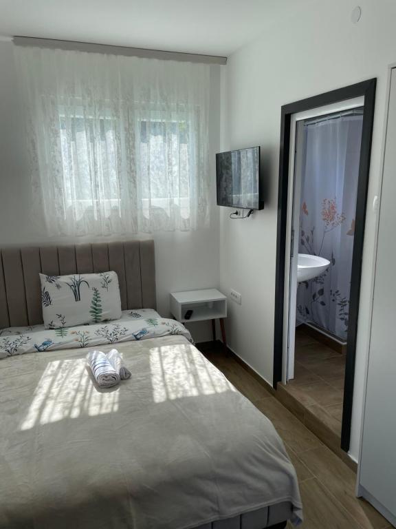 Postel nebo postele na pokoji v ubytování Prenociste "Pače 027" Accommodation "Pace 027"