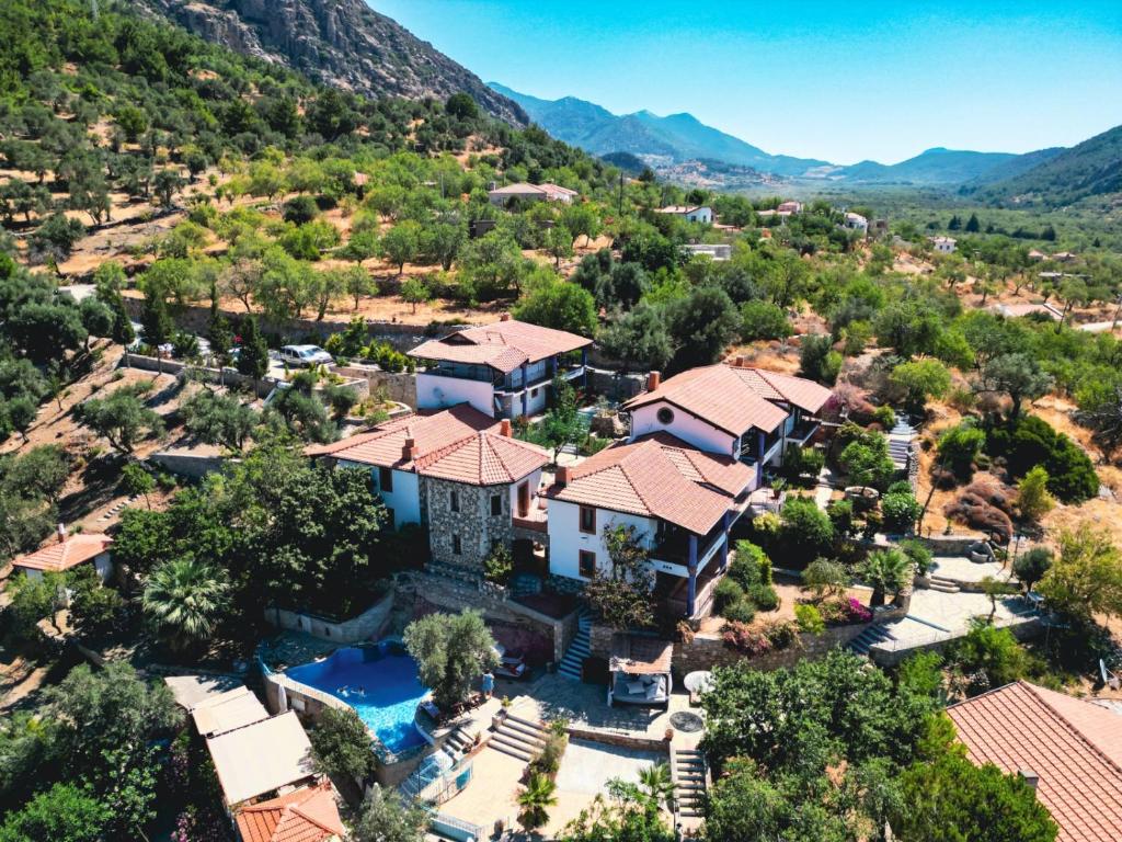 an aerial view of a home in the mountains at Şato Triopia Butik Otel in Yaka