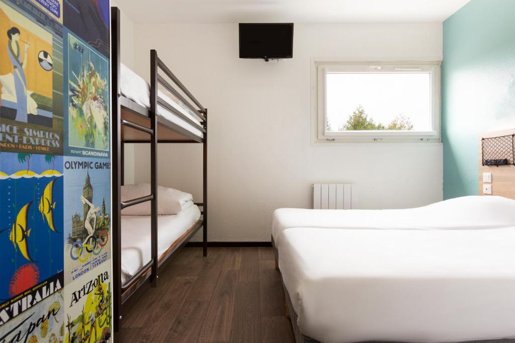 Postel nebo postele na pokoji v ubytování Hôtel F1 Reims Tinqueux