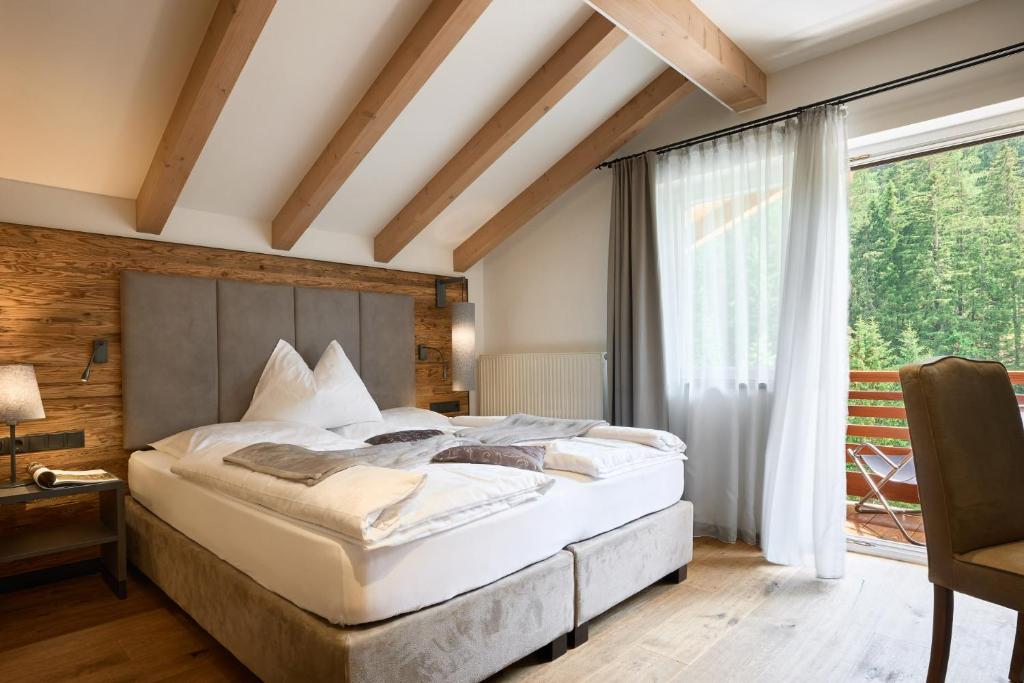 Postel nebo postele na pokoji v ubytování Hotel Comploj Adults only
