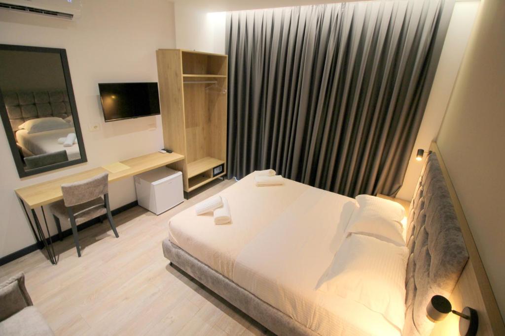 Postel nebo postele na pokoji v ubytování F&J Hotel