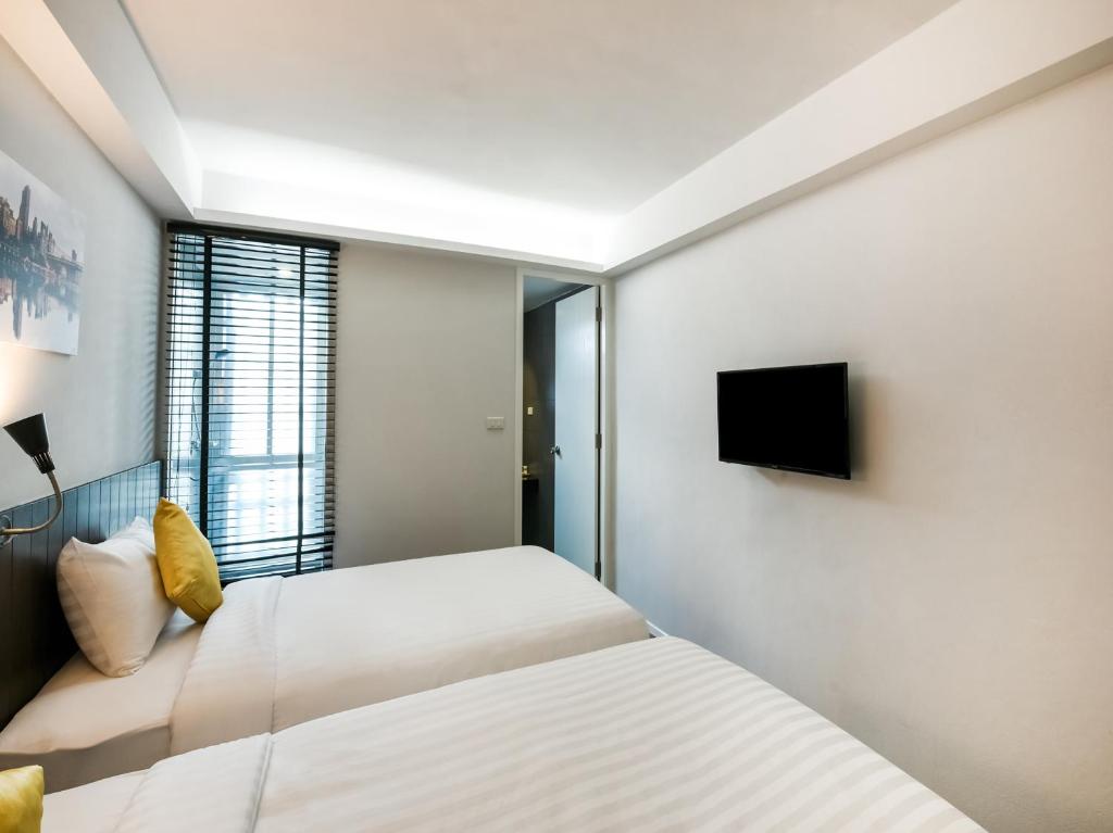 Kitzio House Hotel Huai Kwangにあるテレビまたはエンターテインメントセンター