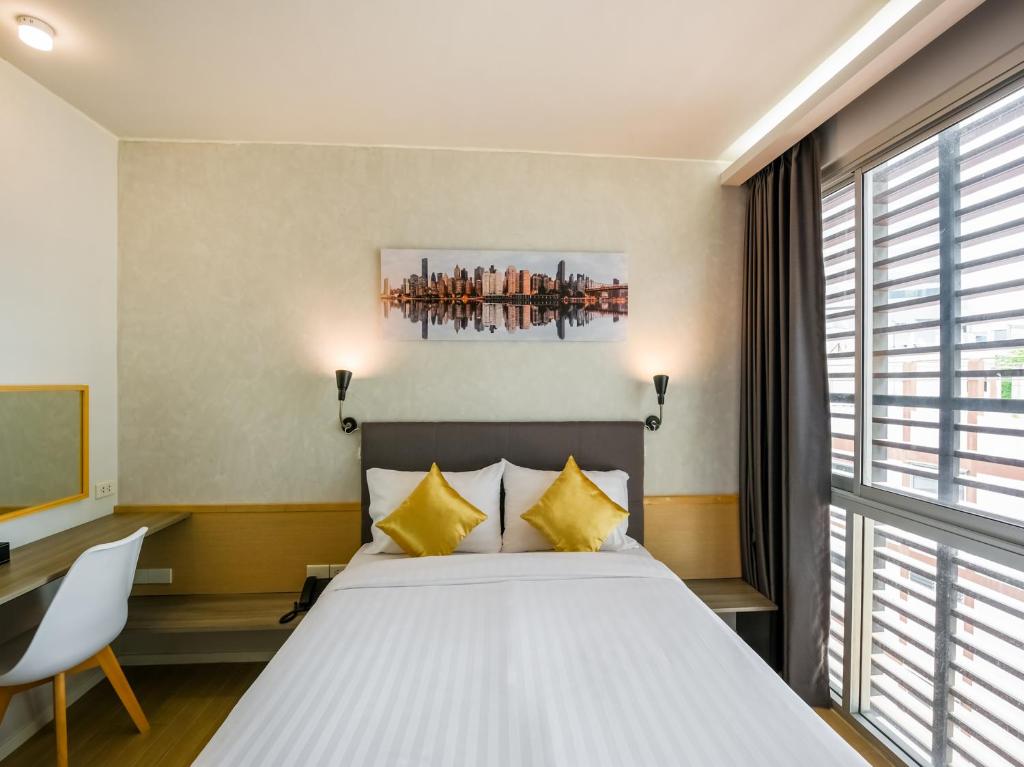 Kitzio House Hotel Huai Kwangにあるベッド