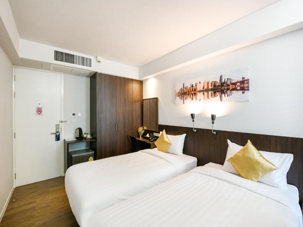 Kitzio House Hotel Huai Kwangにあるベッド