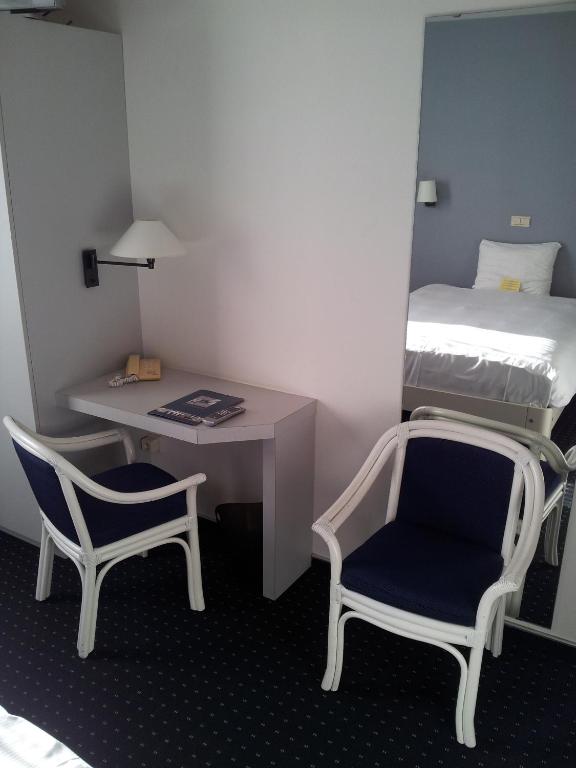 Postel nebo postele na pokoji v ubytování Hotel De Swaen