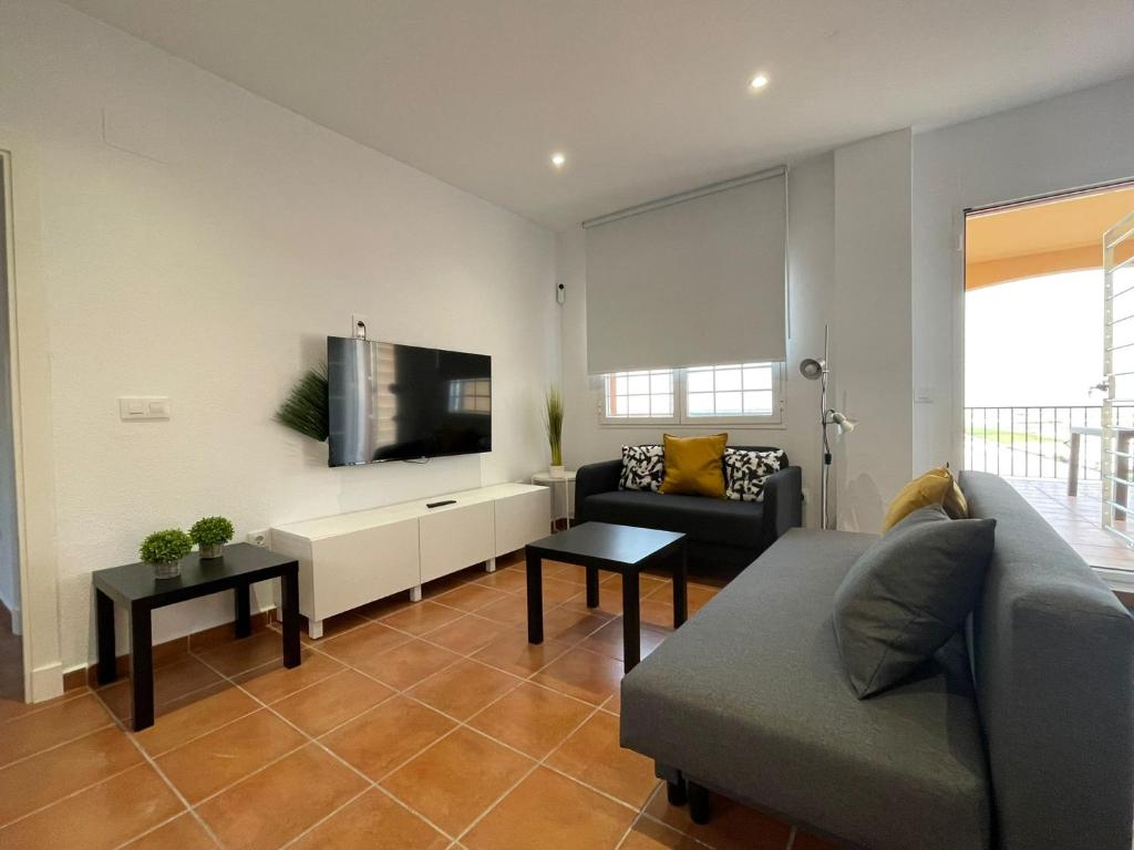 A television and/or entertainment centre at El Mirador del Coto, Apartamentos Living Sur