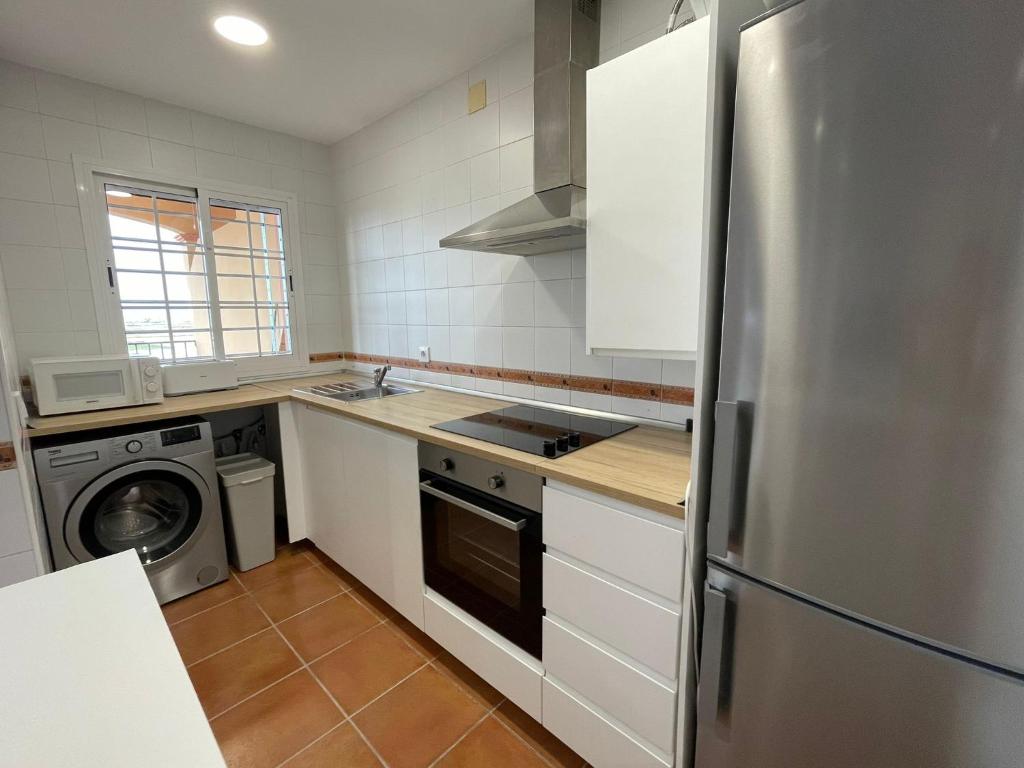 A kitchen or kitchenette at El Mirador del Coto, Apartamentos Living Sur