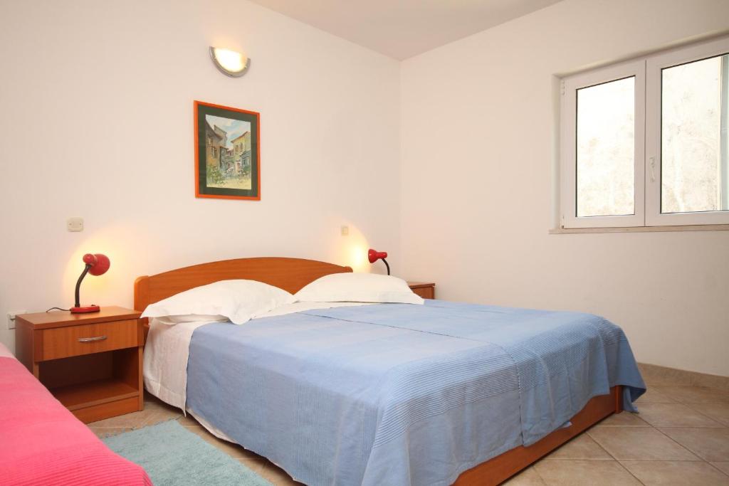 Posteľ alebo postele v izbe v ubytovaní Apartments by the sea Podgora, Makarska - 6725