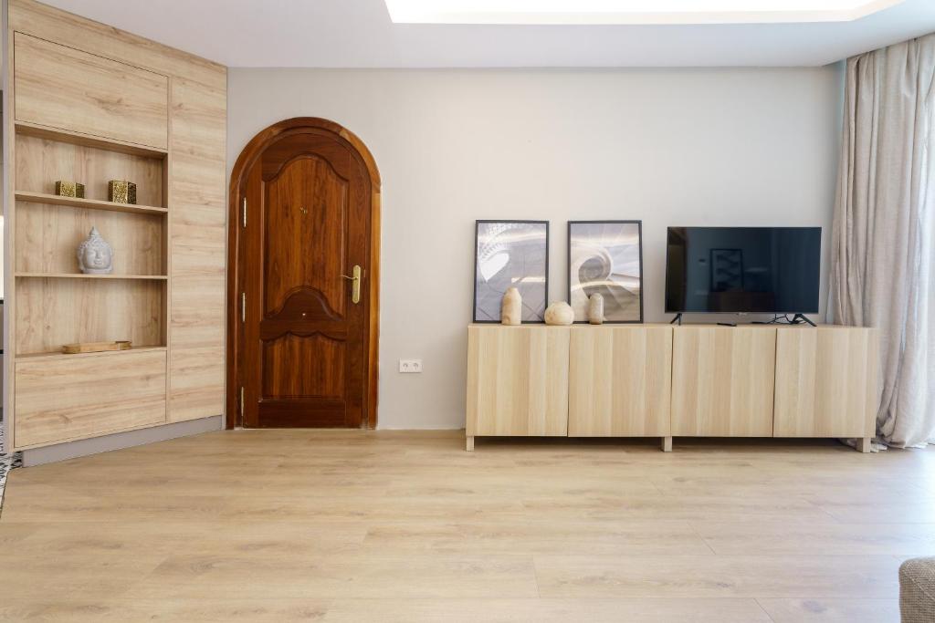 Televízia a/alebo spoločenská miestnosť v ubytovaní LUXURY APARTMENT Benalmadena Costa