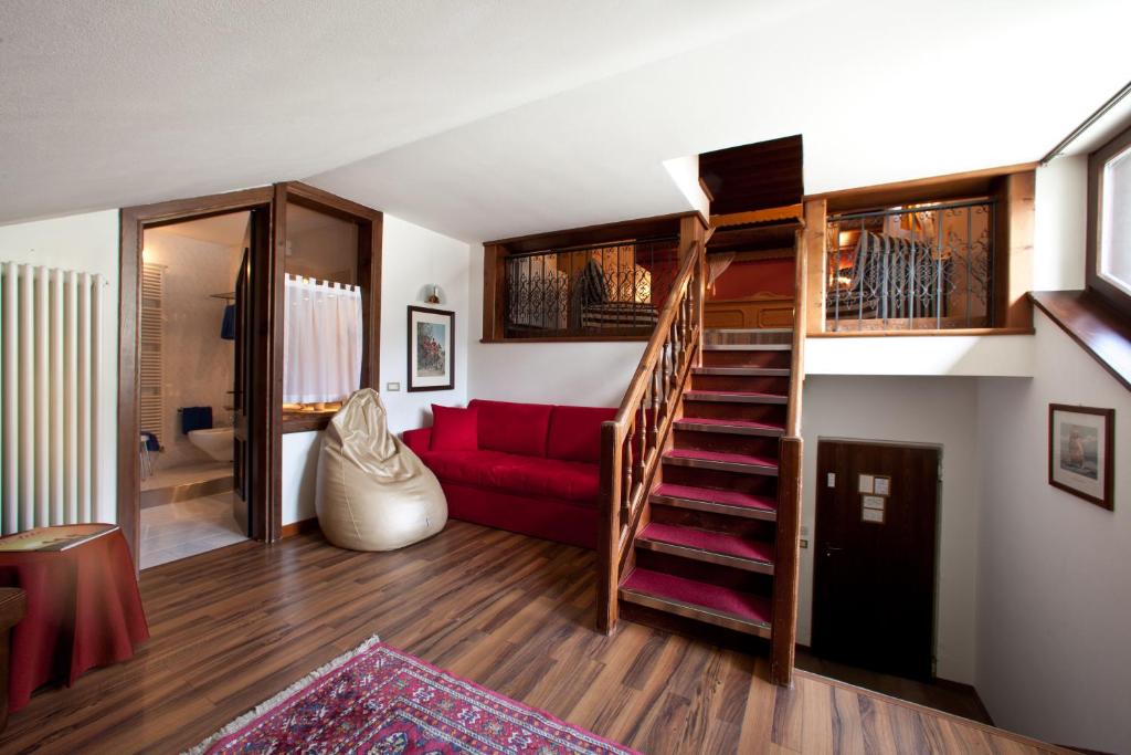 Postel nebo postele na pokoji v ubytování Hotel Baita Clementi