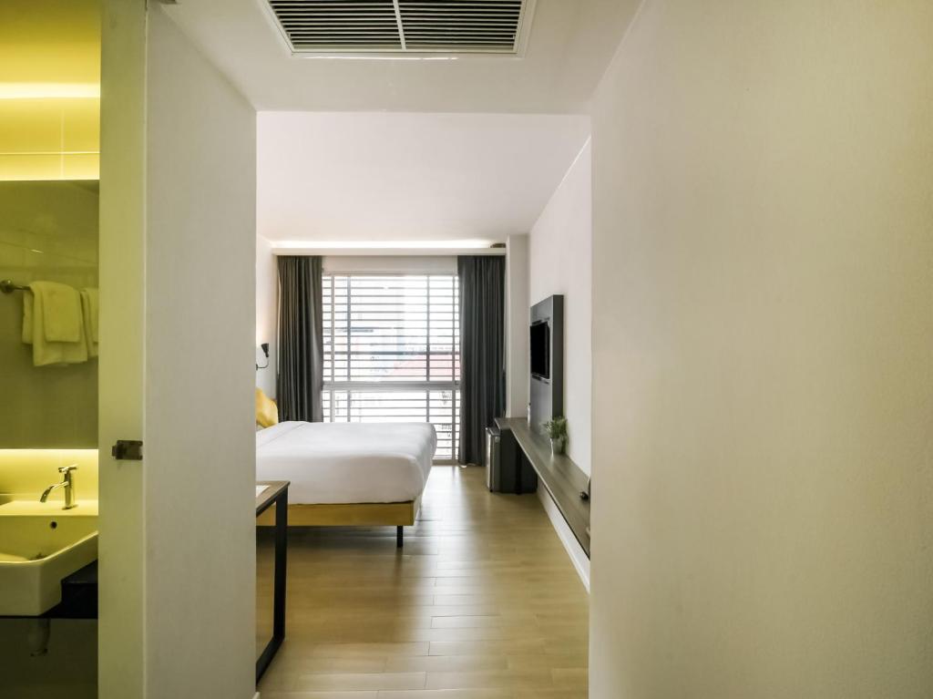 Kitzio House Hotel Huai Kwangにあるベッド