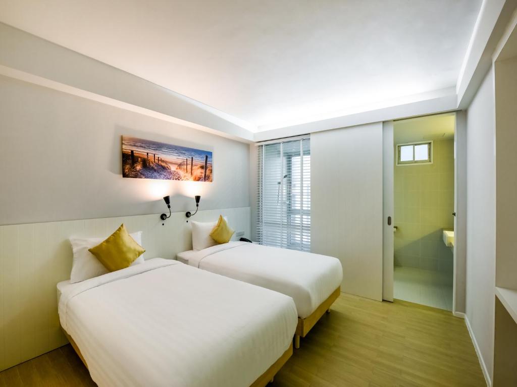 Kitzio House Hotel Huai Kwangにあるベッド