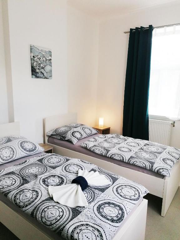Postel nebo postele na pokoji v ubytování Apartmány Plzeň Zábělá 69