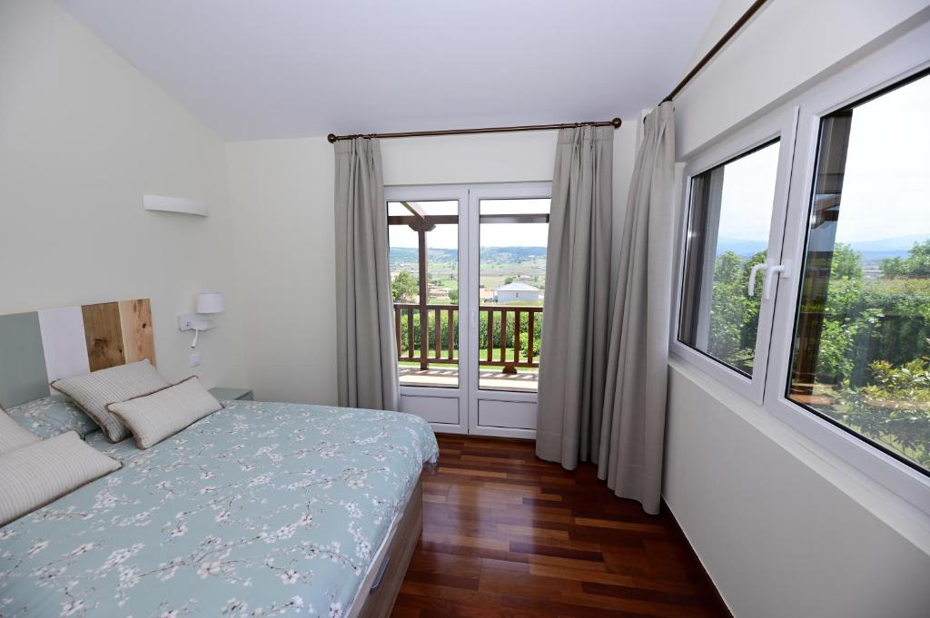 Łóżko lub łóżka w pokoju w obiekcie VILLA&MAR LANGRE BEACH
