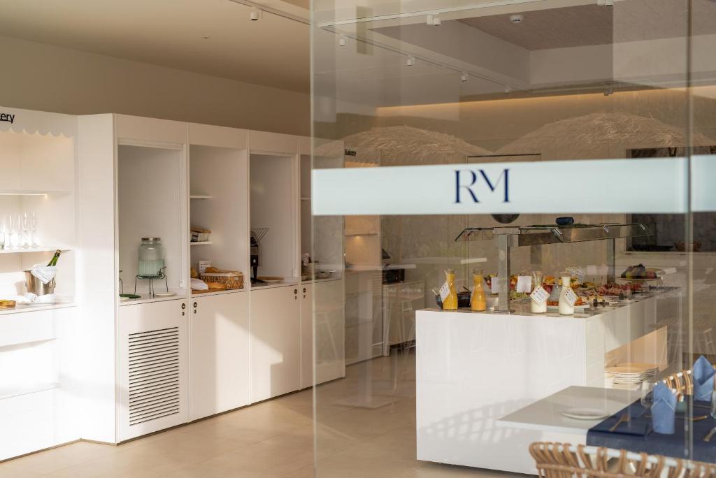 a display case in a room with food on display at Royal Marina Suites Boutique Hotel - Adults Only in Puerto Calero