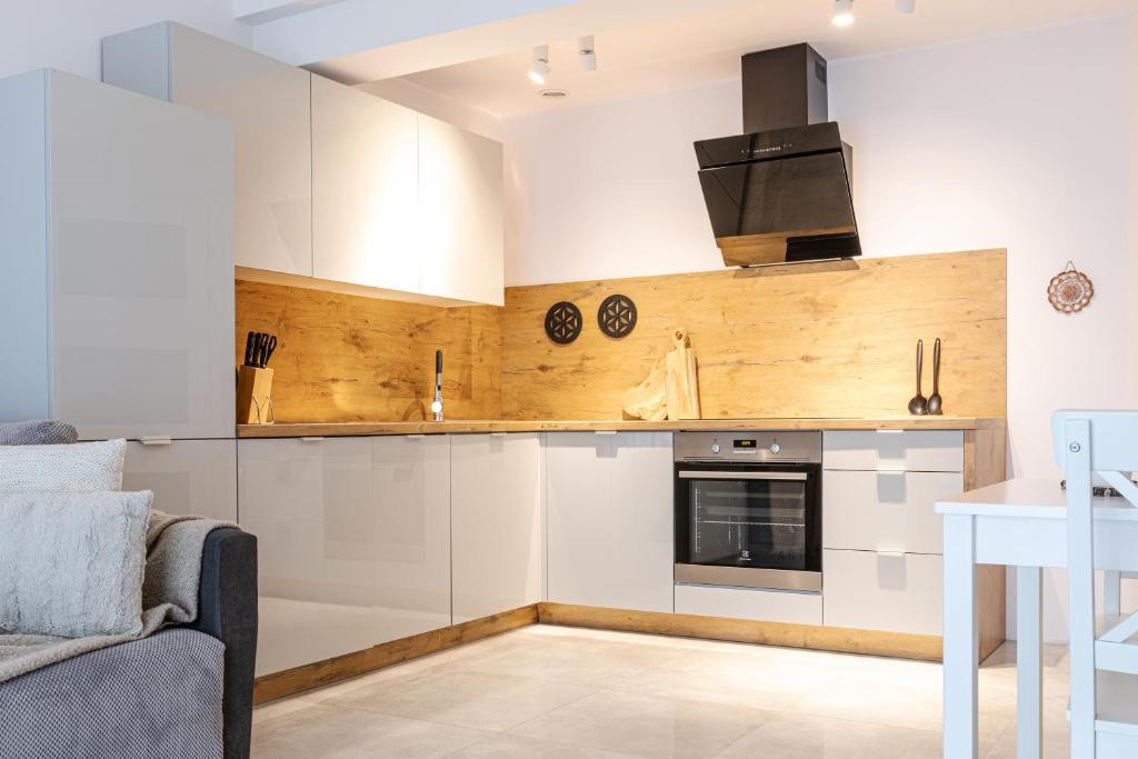 Kuchyňa alebo kuchynka v ubytovaní Apartament Droga na Bystre 5b/8