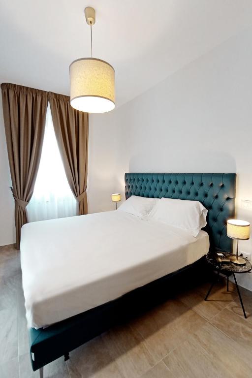 Łóżko lub łóżka w pokoju w obiekcie Boutique Hotel Palazzo Donna Iulia
