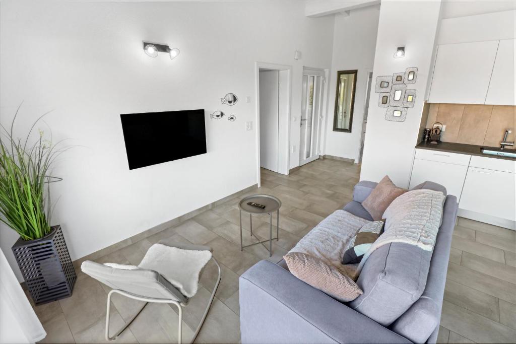 TV a/nebo společenská místnost v ubytování Superbe appartement neuf et cosy
