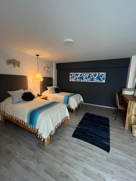 Postel nebo postele na pokoji v ubytování Zen Suites by Regente