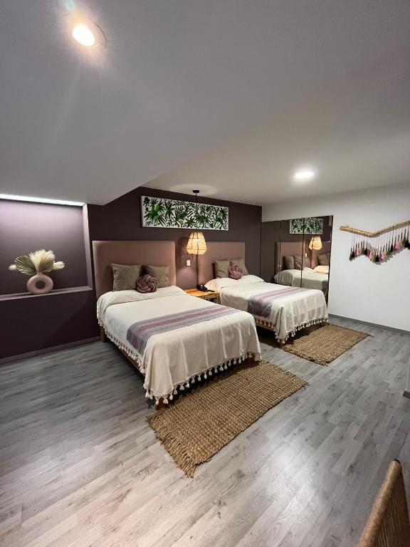 Postel nebo postele na pokoji v ubytování Zen Suites by Regente