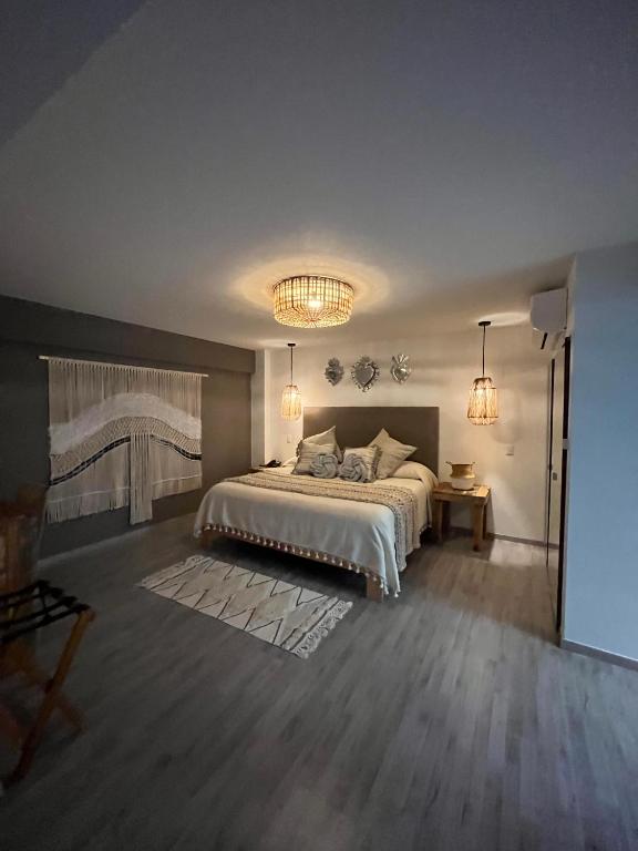 Postel nebo postele na pokoji v ubytování Zen Suites by Regente