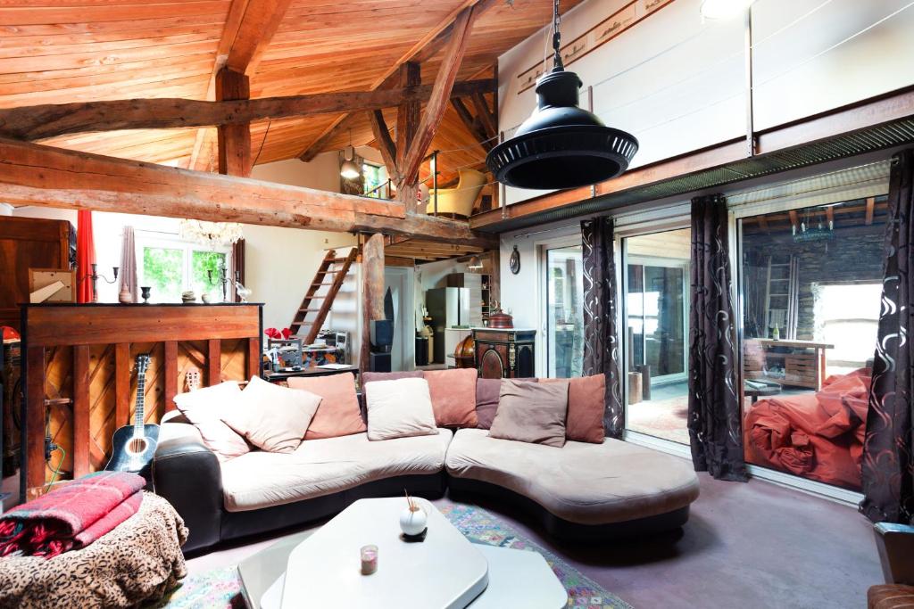 a living room with a couch and a table at L'Audace in Mâcot La Plagne