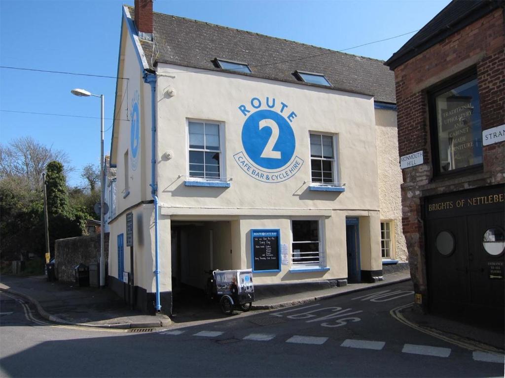 a building with a sign on the side of it at Route 2 Apartments in Topsham