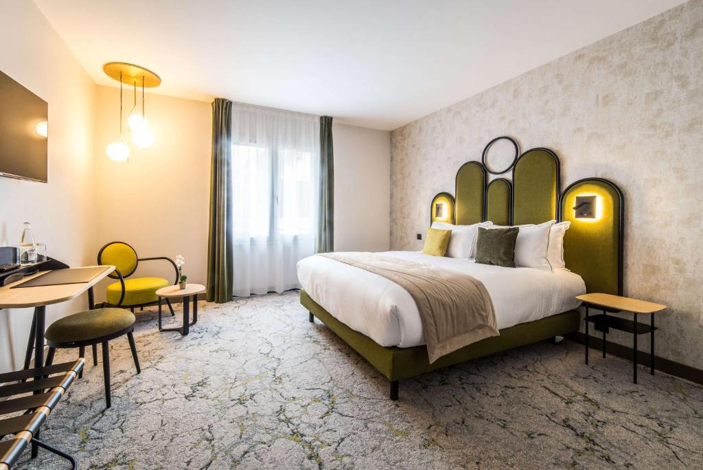 Postel nebo postele na pokoji v ubytování Best Western Le Relais du Vigneron
