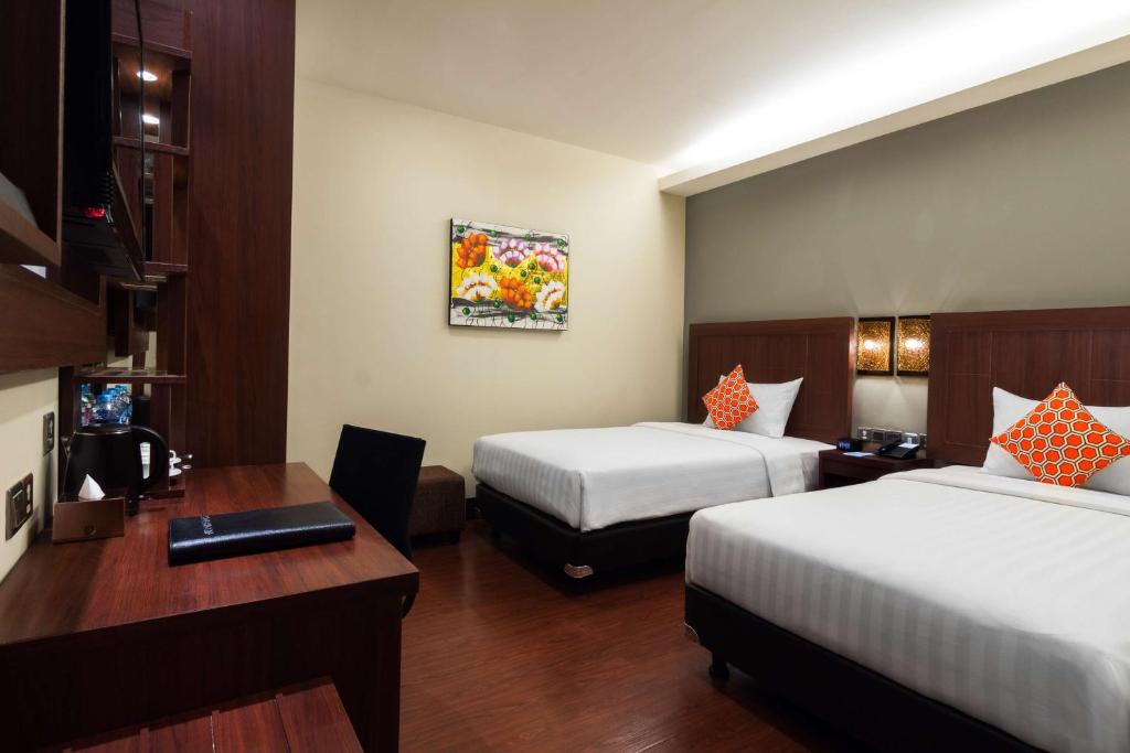 Postel nebo postele na pokoji v ubytování Best Western Senayan
